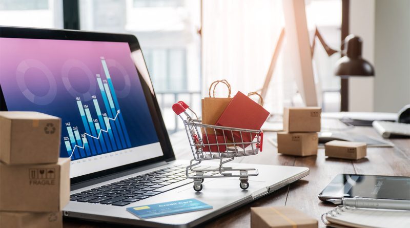 Image of a laptop on a desk with a graph on the screen to support Bullwhip Effect article