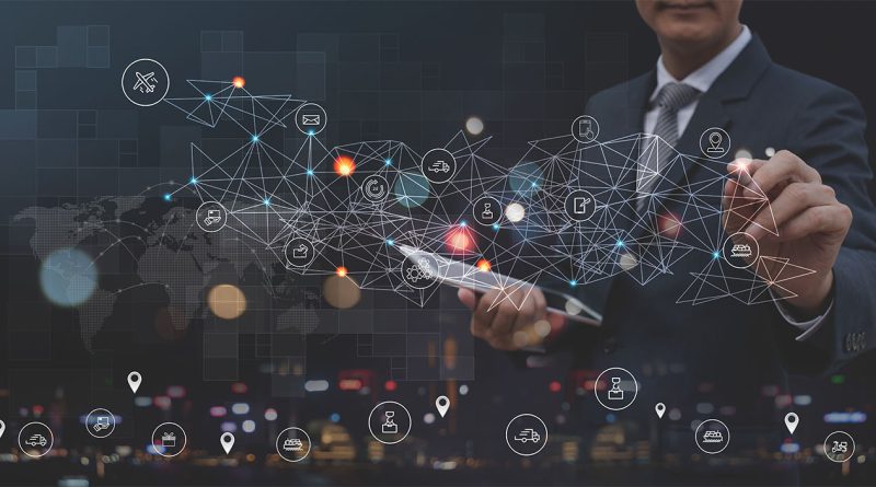 Futuristic image of a man in a suit stood at an artificial wall with a tablet and pen drawing a map with lights to support supply chain innovations article