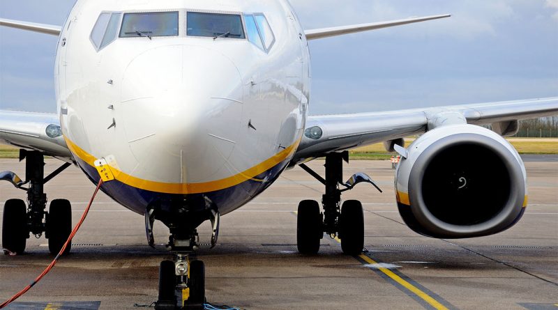 Close-up image of a white Boeing plane on a runway