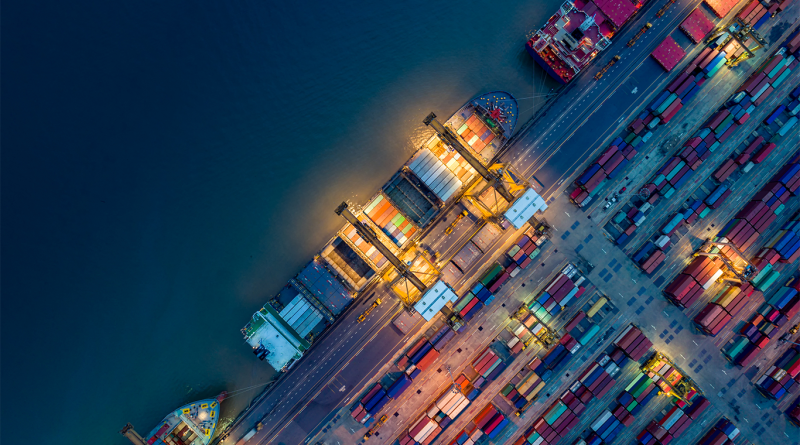 Birds eye view image of multiple supply lorries on a road to support supply chain visibility article