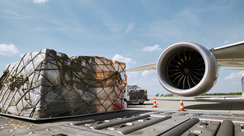 Air cargo containers being loaded onto a freighter at a Chinese airport.