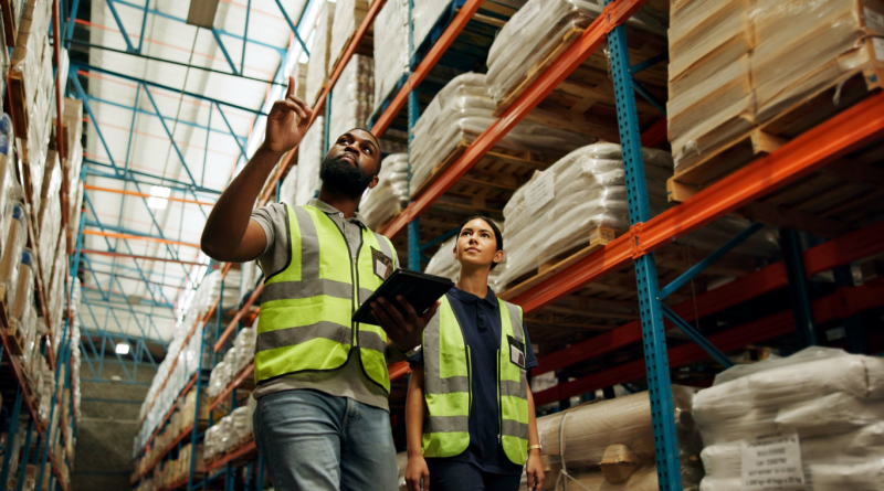 Two supply chain professionals in high-visibility vests, representing the delivery and sourcing stages of supply chain management.