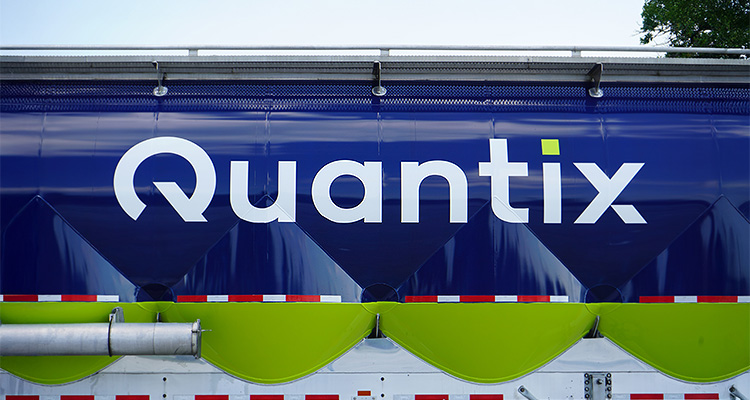 logo and name "Quantix" on the side of a large vehicle or trailer