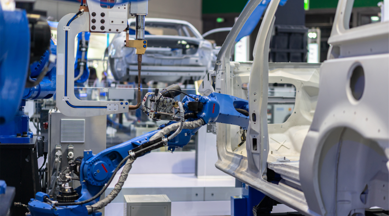 A partially assembled vehicle on a halted production line at an automotive plant.