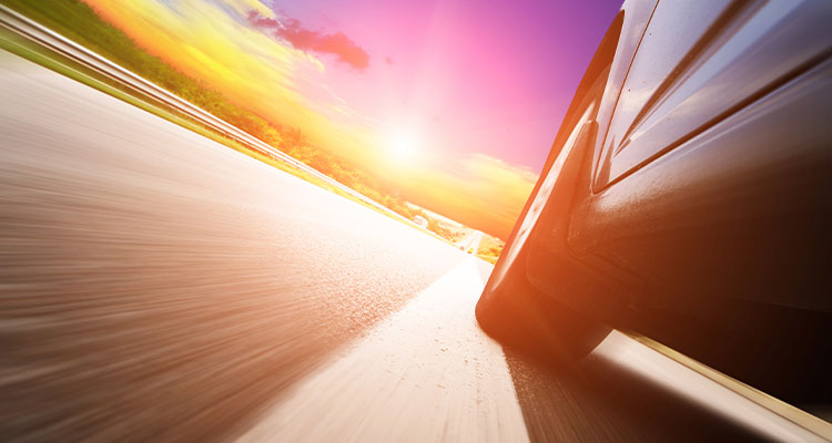 a car moving at a high speed with a blurred effect to emphasize motion
