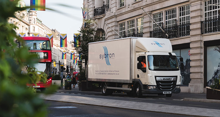 a DAF truck with the logo of a company called Sybron on its side