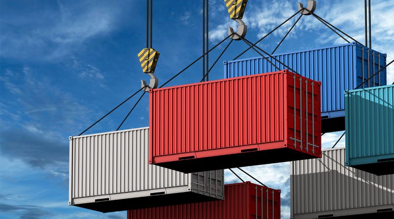 Stacked freight containers and a truck at a logistics yard illustrating rising financial impact of supply chain theft