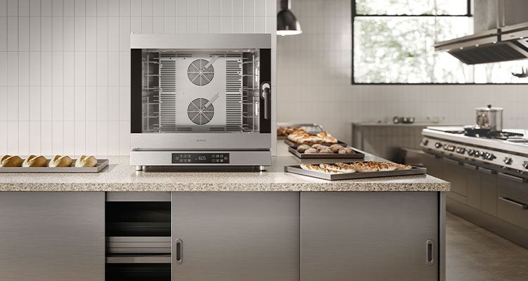 How Smeg UK’s professional division is bringing design excellence to professional kitchens kitchen setting featuring a Smeg convection oven on a marble countertop